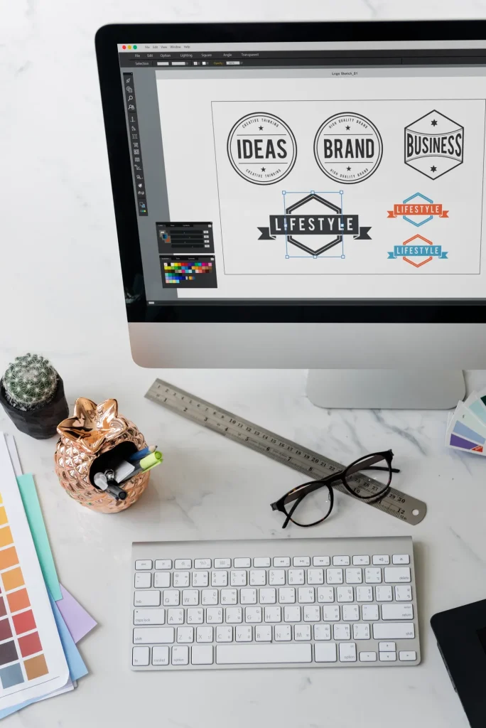 Logo designs shown on a desktop screen